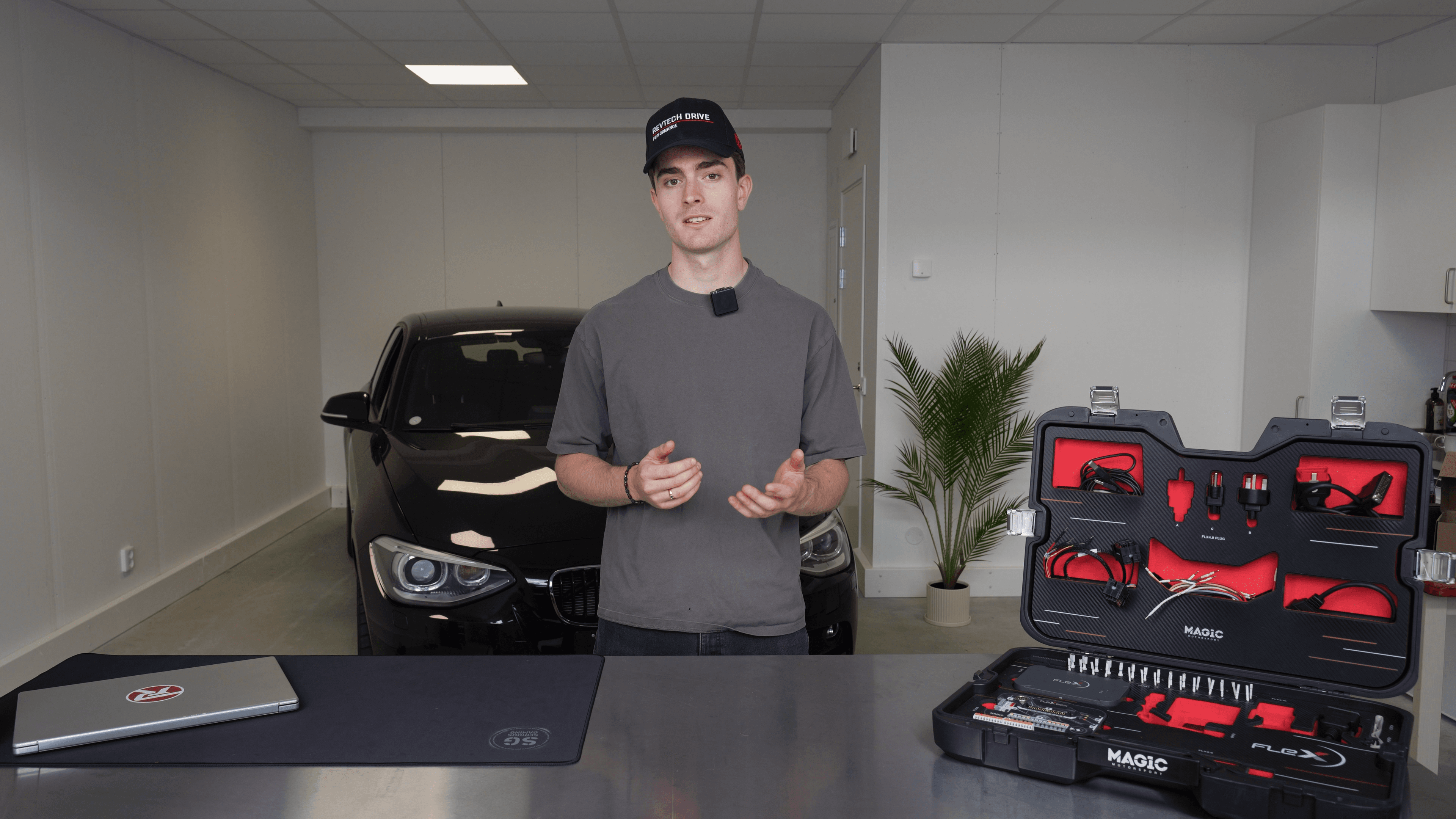 Revtech instructor presenting ECU tuning tools in the workshop